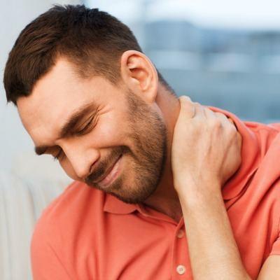 young man with a neck injury waiting for his adjustment.